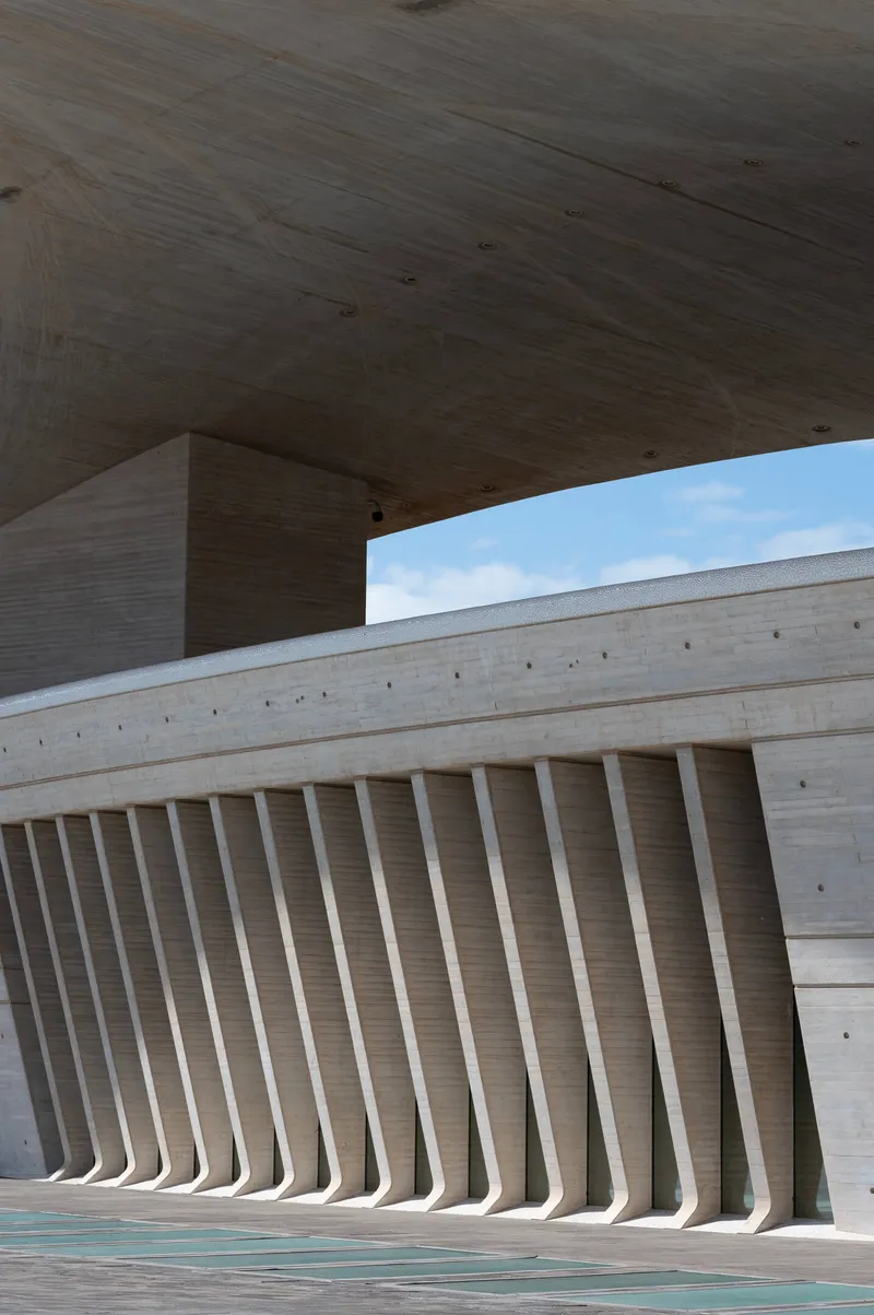 Rhythmic concrete fins of the Auditorio de Tenerife seen from beneath the main arch