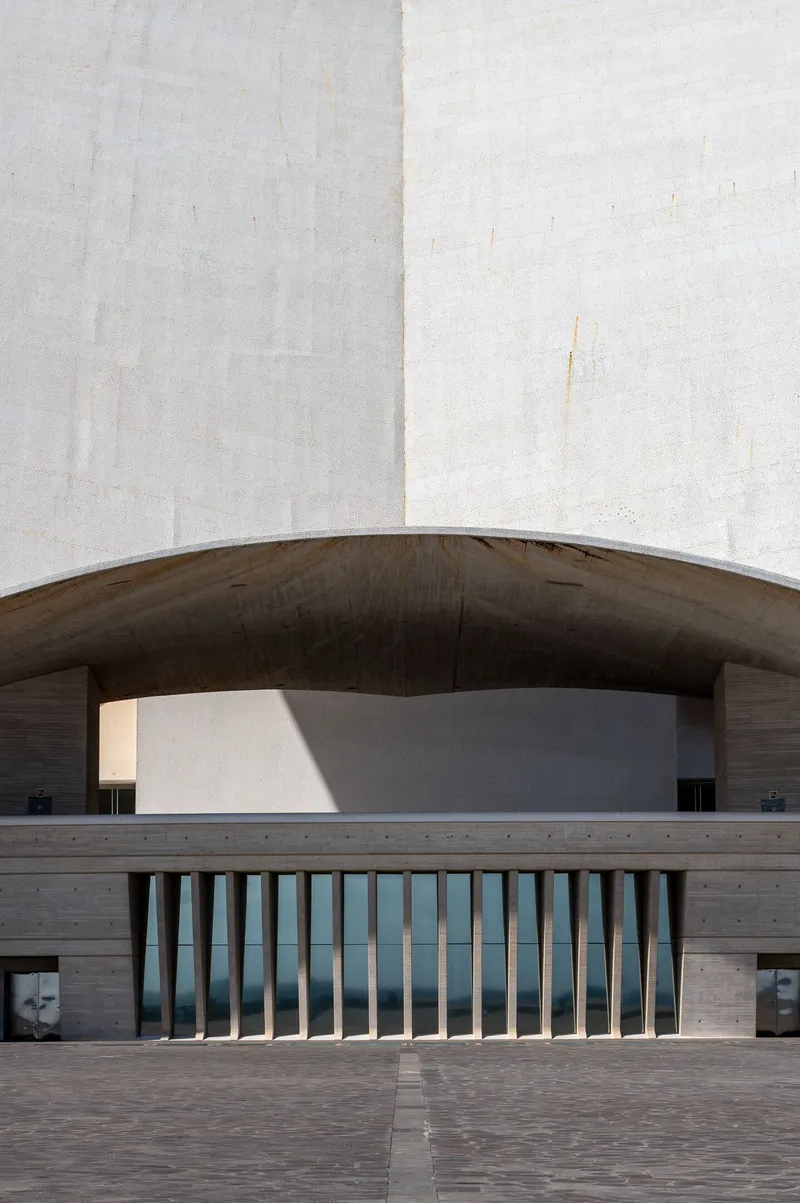 Frontal symmetrical view of the entrance arch of the Auditorio de Tenerife with its rhythmic vertical columns, Santa Cruz de Tenerife