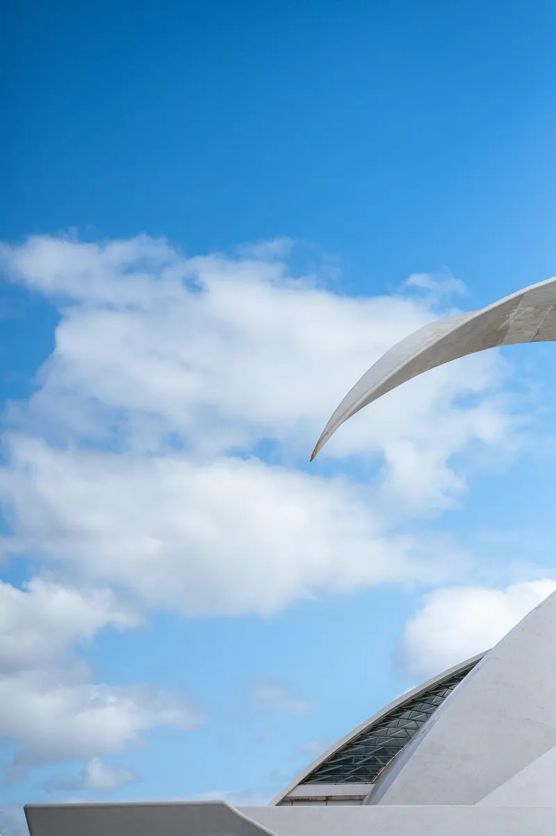The tip of the main arch of the Auditorio de Tenerife reaching into a sky of clouds, Santa Cruz de Tenerife